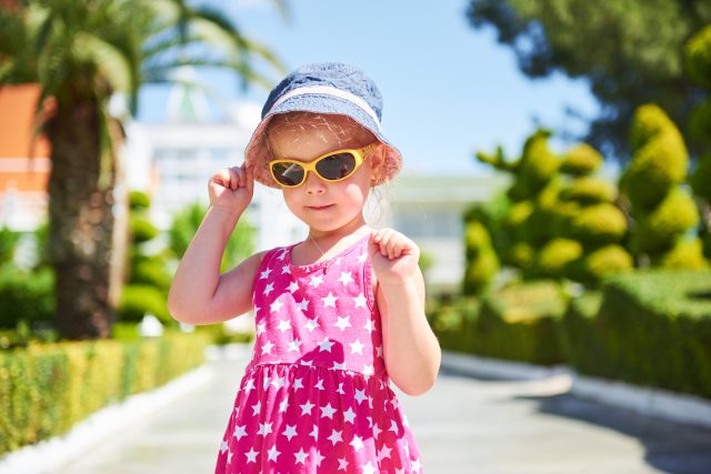 portrait happy child wearing sunglasses outdoors summer day amara dolce vita luxury hotel resort tekirova kemer turkey